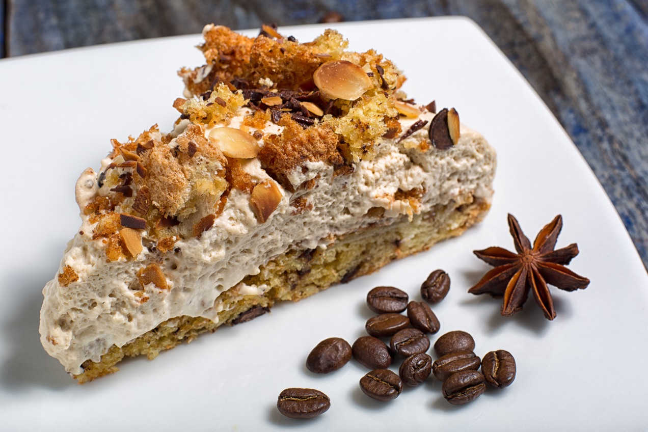 A close up of a slice of cake showing its texture.