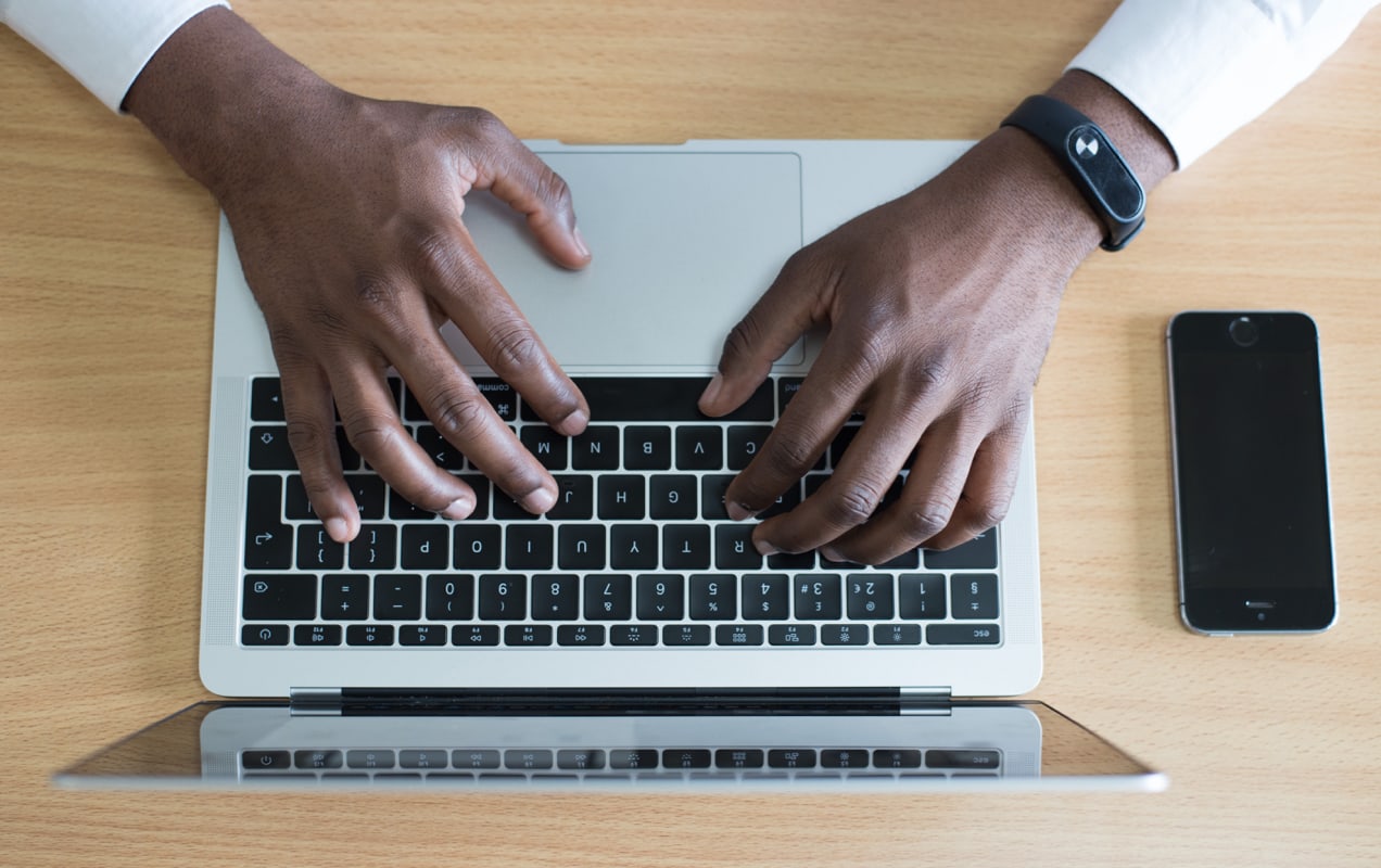 entrepreneur typing and creating content on a computer