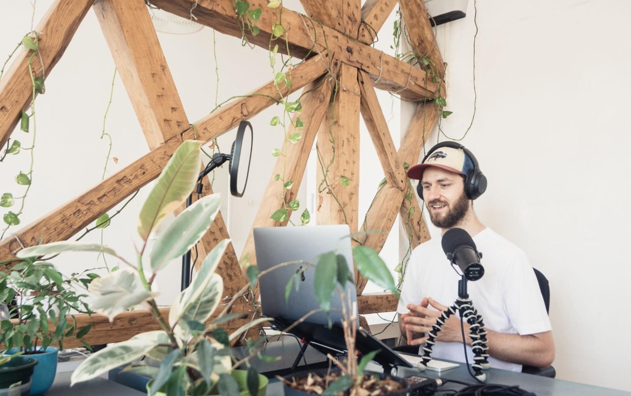 podcaster in front of a computer