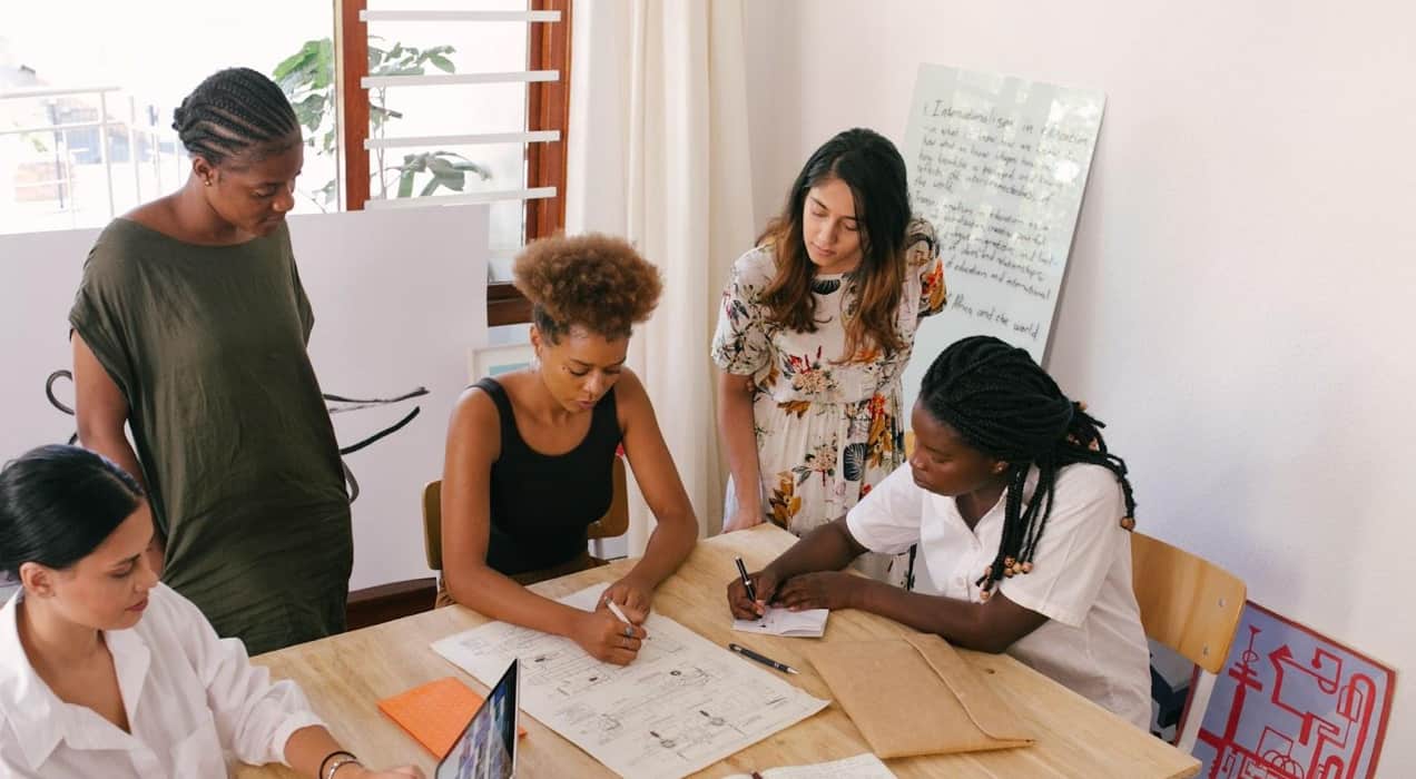 team of women working around a table