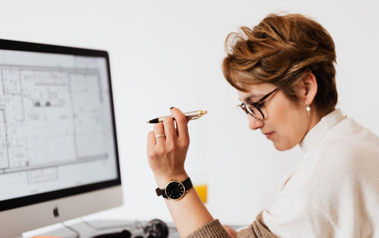 business owner working on her desktop computer