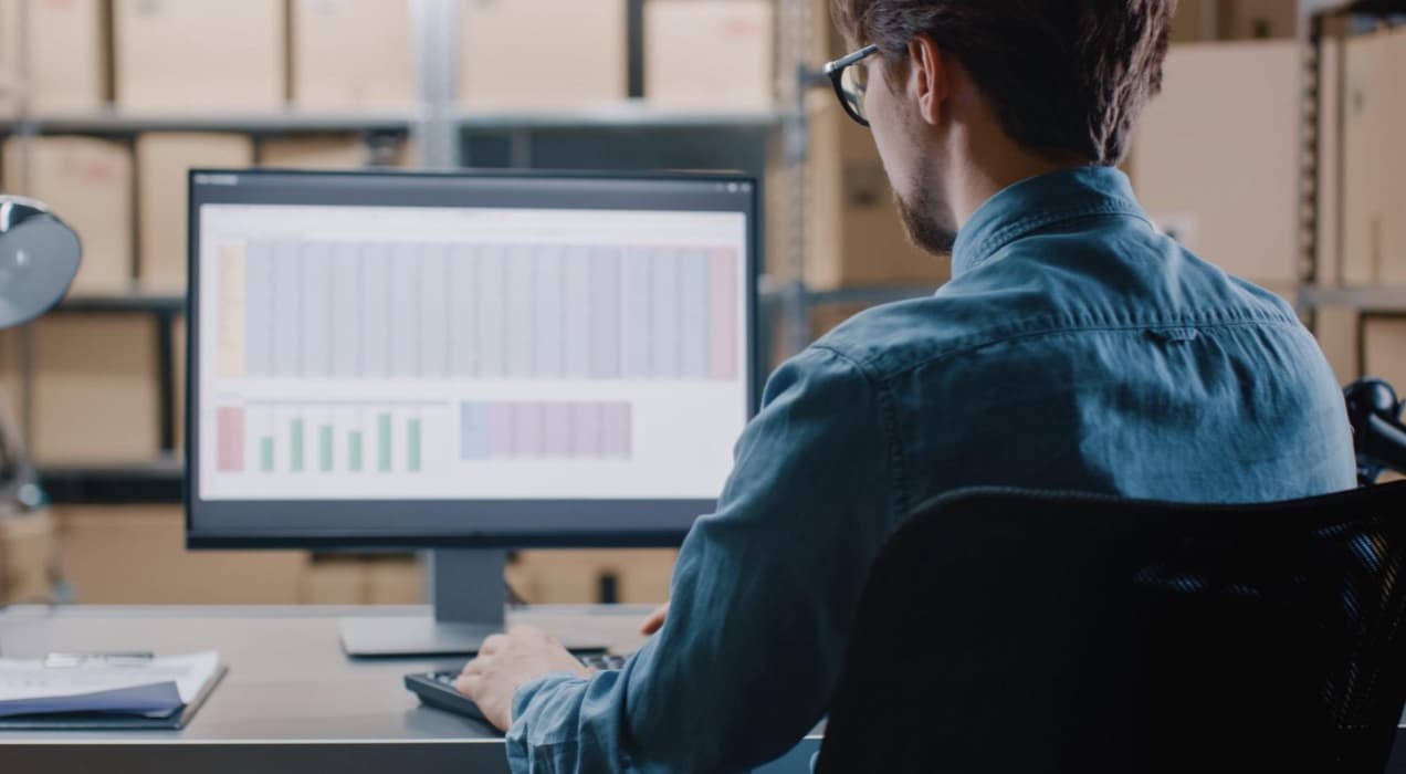 man working on a spreadsheet