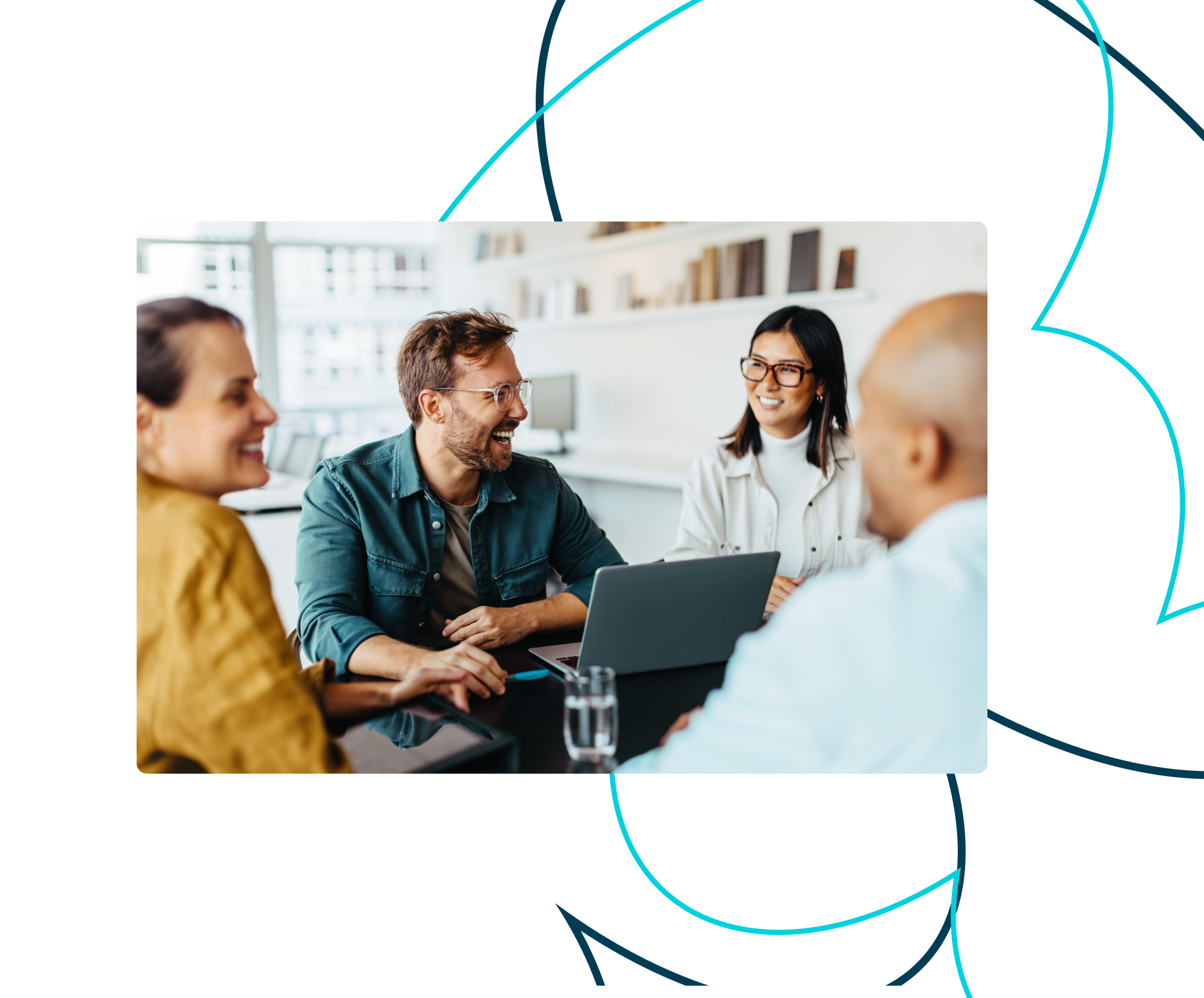 A group of developers, designers and marketers who work in an agency sitting around a table.